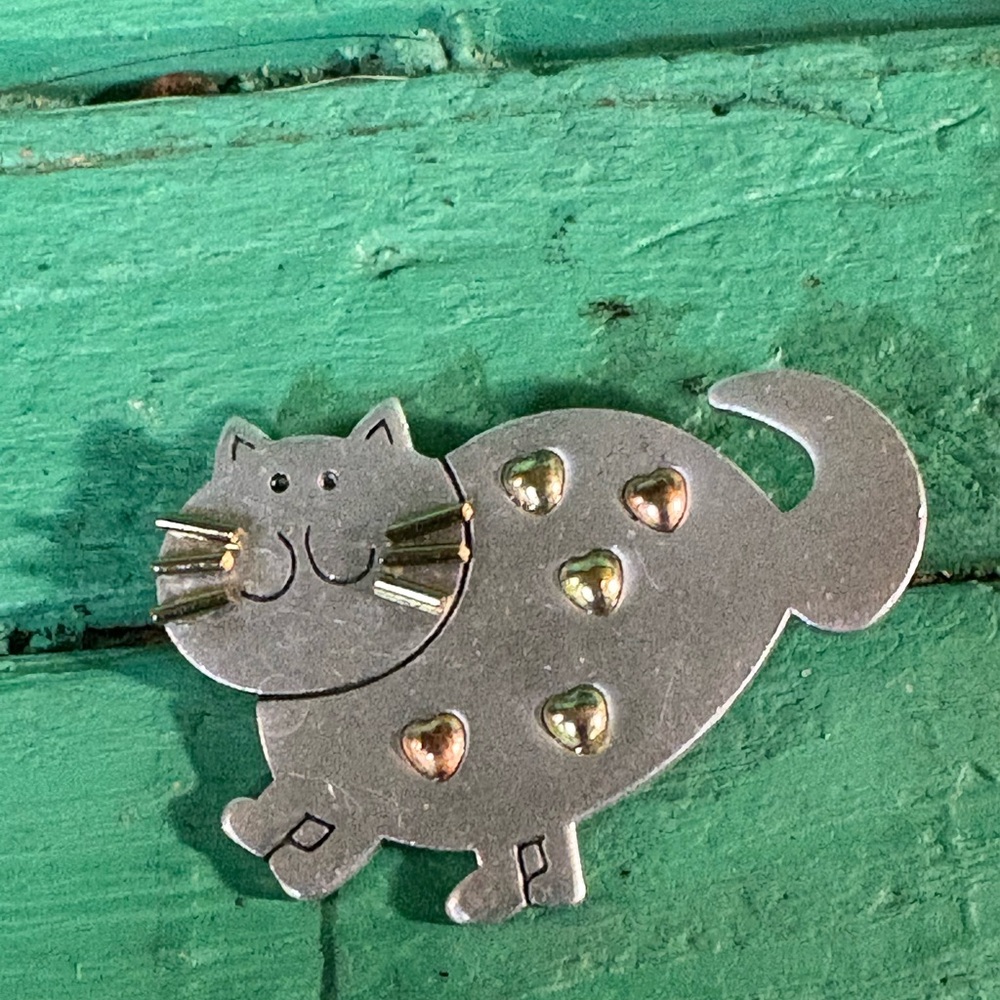 Charming Silver Cat Brooch with Gold Heart Accents